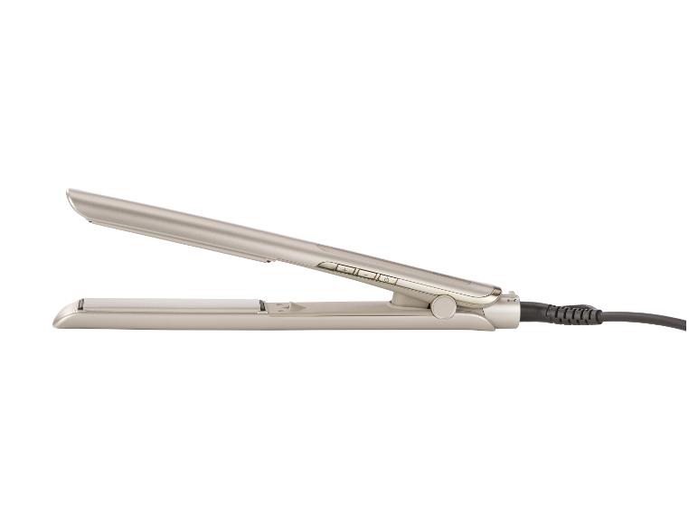 Béžová žehlička na vlasy s ovládacími tlačítky a černým kabelem.