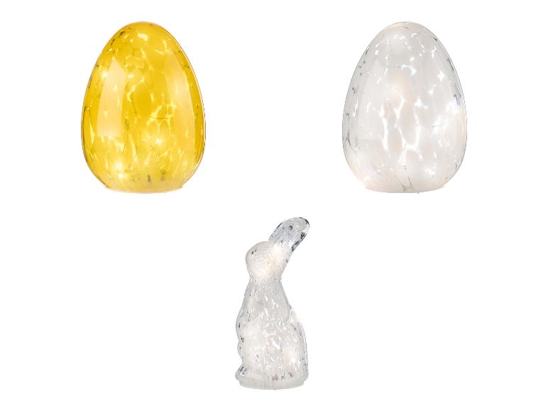 Dvě skleněná vejce s lampičkami a králík.