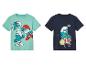 Dvě trička pro chlapce se Smouly, jedno s bicí soupravou a jedno s různými Smouly.