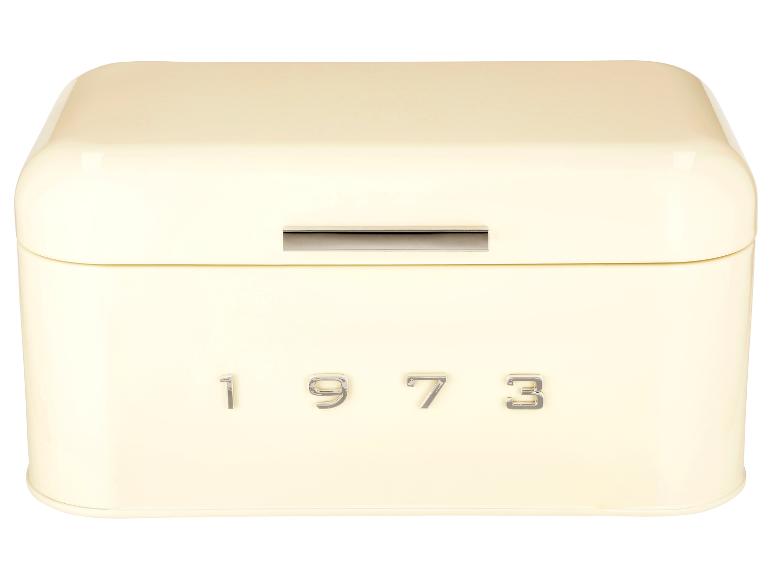 Krémová kovová krabička na chleba s nápisem '1973'.
