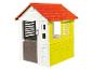 Bílý a žlutý dětský domeček s červenou střechou od Smoby.