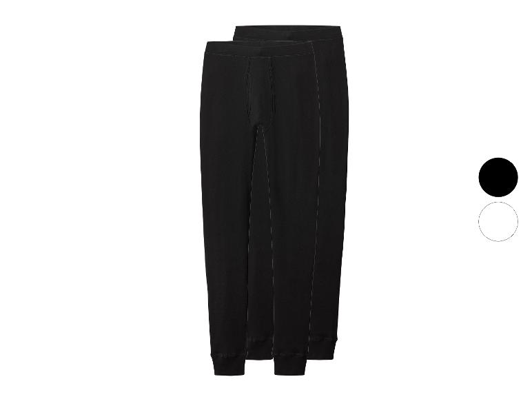 Dva páry černých pánských termoprádel s černým a bílým vzorníkem barev.