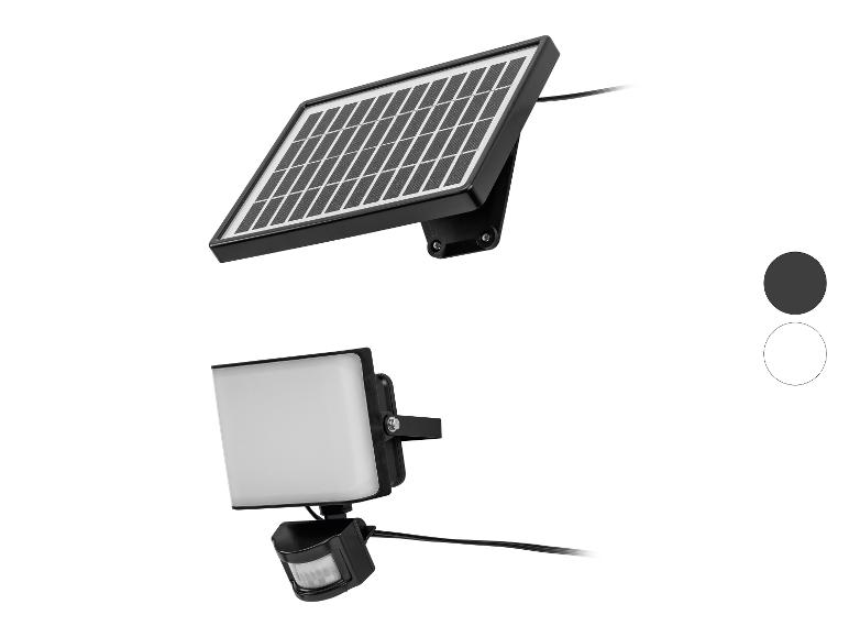 Solární LED reflektor s pohybovým senzorem, dostupný v černé a bílé barvě.