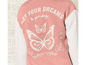 Růžový svetr s bílými motýly a textem 'Let your dreams be your wings'.