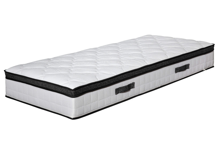 Bílý matrace s černým okrajem a rukojetí.