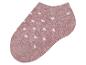 Růžová ponožka s bílými puntíky.