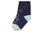 Modrá ponožka s obrázkem slunce a lodi.