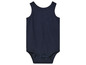 Tmavě modrý overal pro miminka se zapínáním na patentky.