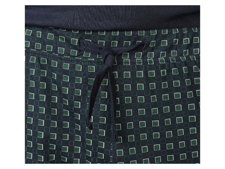 Detail modrých kalhot se zeleným vzorem