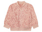 Růžová bomber bunda s květinovým vzorem.