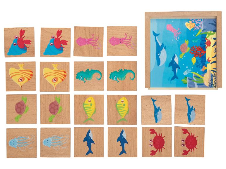 Dřevěná skládačka s obrázky mořských zvířat, včetně velryb, žraloků, krabů a želv.