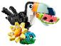 Figurka tukana LEGO Creator 3-v-1, s plátkem melounu a květinou.