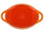 Oranžová, oválná zapékací mísa SilverCrest se dvěma úchyty.