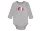 Šedý dětský overal s dlouhým rukávem s potiskem domků.