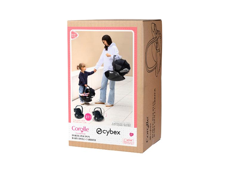 Dárková krabice s dětskou autosedačkou Corolle a Cybex pro panenky.