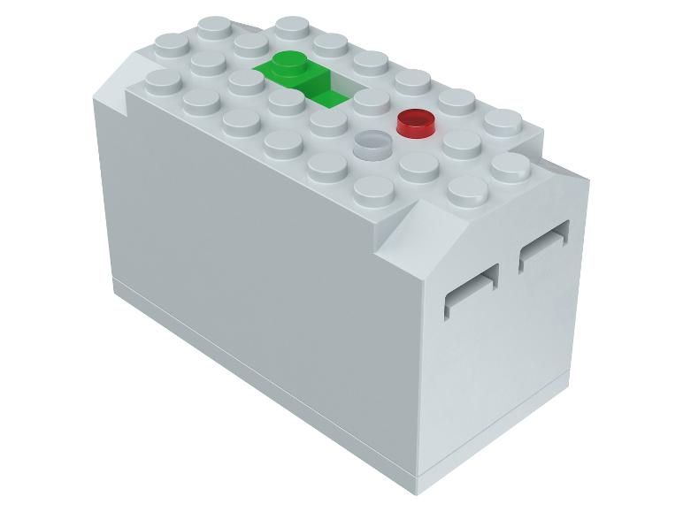 Šedá LEGO kostka se zeleným a červeným tlačítkem.