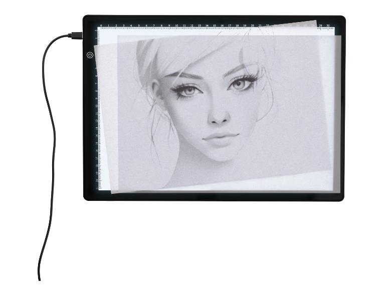 LED světelná podložka s kresbou ženského portrétu a USB kabelem.