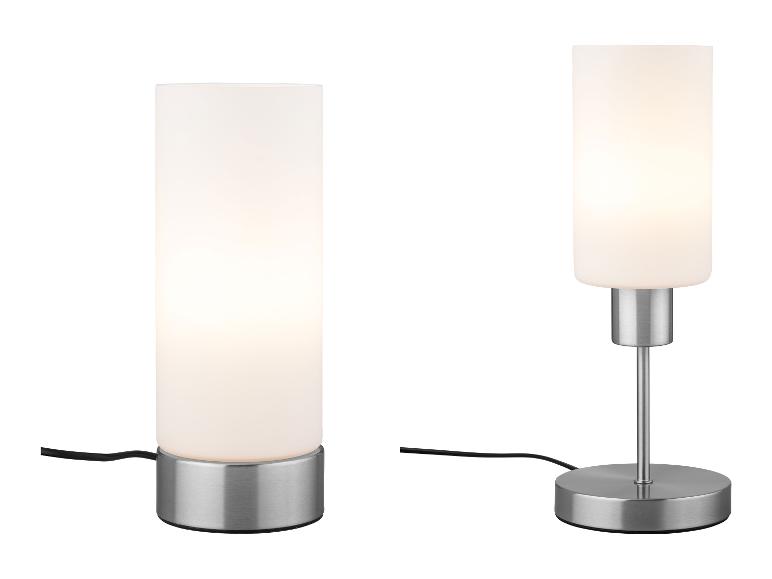 Dvě moderní stolní lampy s válcovými stínítky z matného skla a kovovými podstavci.