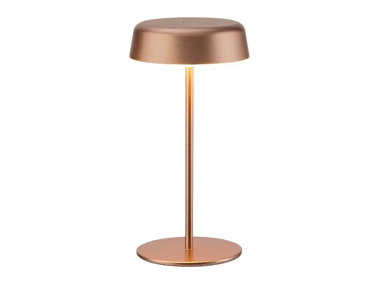 Růžově zlatá přenosná LED stolní lampa s kulatou základnou a stínítkem, vyzařující teplé světlo