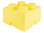 Žlutá LEGO krabička se čtyřmi LEGO kostkami.