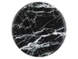 Kulatý, černý podtácek s mramorovým vzorem.