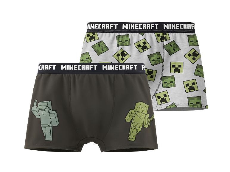 Dvoje dětské boxerky s motivem videohry, jedny s hlavami Creeperů, druhé s postavami.