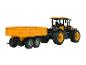 Traktor JCB se žlutým přívěsem, miniaturní hračky.