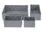 Čtyři šedé úložné koše z pleteného materiálu.