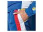 Lidl sportovní oblečení: modrá tepláková souprava s bílými a červenými pruhy.