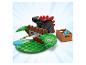 LEGO dinosaurus s červenými hroty, hnědou strukturou a bednou modrých disků.