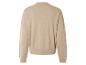 Béžový pletený svetr s dlouhými rukávy.