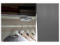 LED osvětlení do skříně, namontované na stropě, osvětluje zavěšené oblečení.