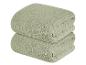 Dva světle zelené, strukturované ručníky.