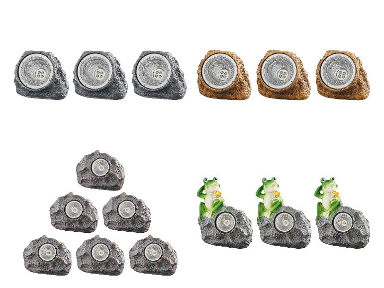 Solární LED světla ve tvaru kamenů a žab.