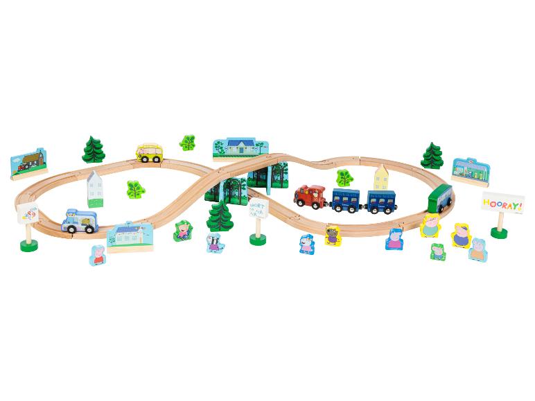 Dřevěná vlaková souprava Peppa Pig s kolejemi, vozidly a figurkami.