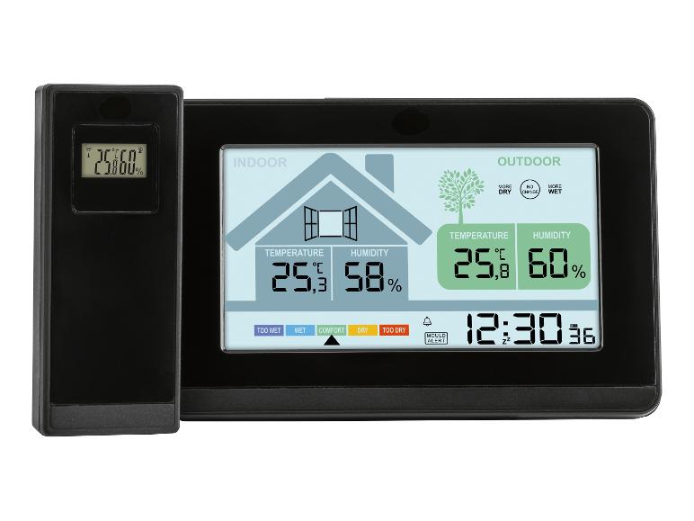 Digitální teploměr a vlhkoměr zobrazující vnitřní a venkovní teplotu a vlhkost.