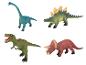 Čtyři různé plastové dinosauři, včetně T-Rexa.