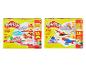 Dvě sady Play-Doh: veterinární sada s figurkami zvířat a stavební a tvarovací sada s nástroji.
