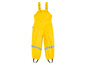Žluté nepromokavé kalhoty s popruhy pro děti.
