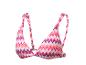Bikini top s barevným cikcak vzorem, ideální na pláž.