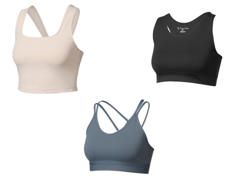 Tři sportovní podprsenky v různých barvách a stylech, včetně černé sportovní podprsenky Crivit.