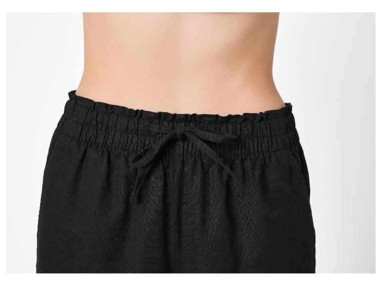 Dámské černé kalhoty s elastickým pasem a stahovací šňůrkou.