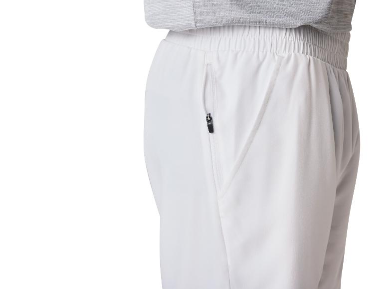 Elegantní bílé kalhoty s kapsami na zip.