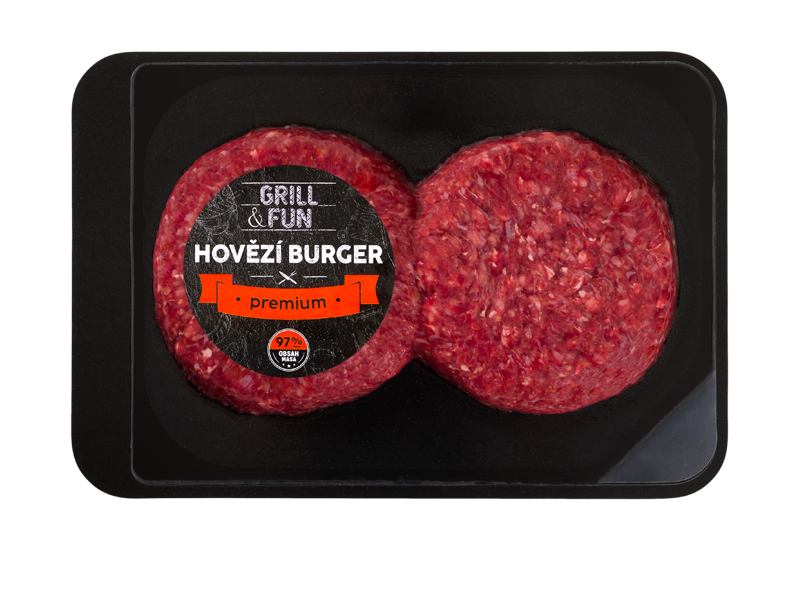 Dva syrové hovězí burgery v černém obalu, jeden s černým štítkem s nápisem 'HOVĚZÍ BURGER premium'.