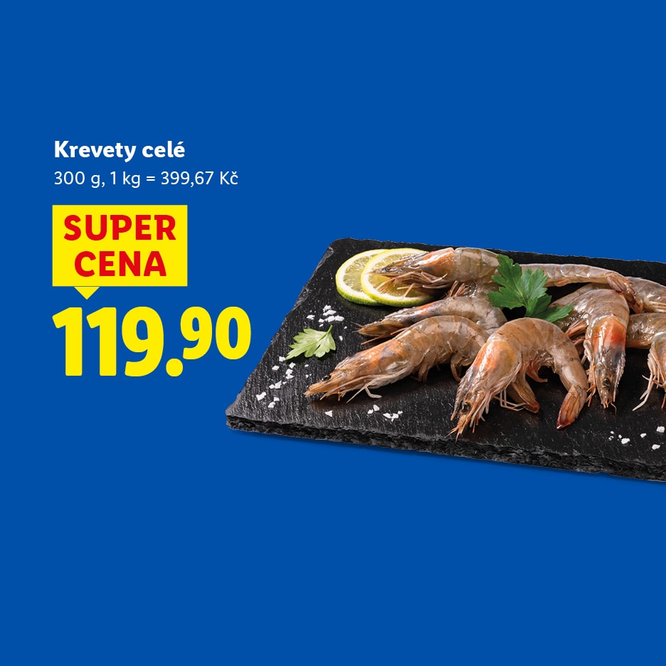 Krevety celé s citronem a petrželkou na černé desce, cena 119.90 Kč za 300 g.