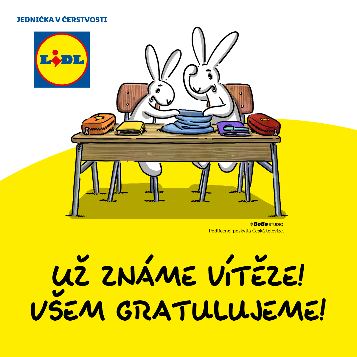 Zábavný obrázek s králíky u školní lavice s produkty Lidl, oznamující vítěze soutěže.