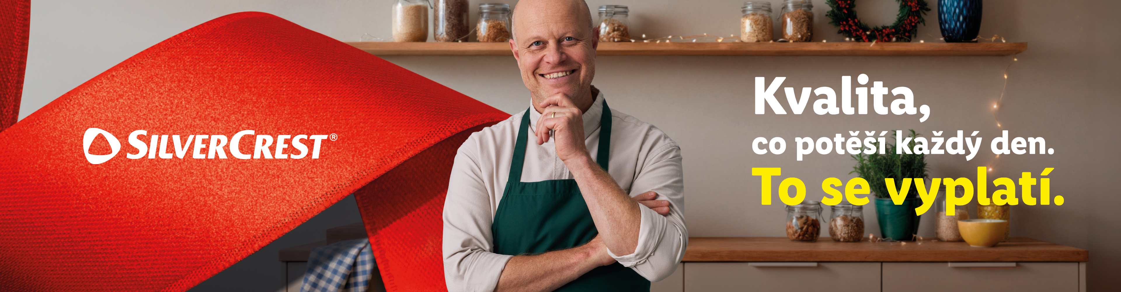 Muž v zástěře se usmívá, s textem „Kvalita, co potěší každý den. To se vyplatí.“ a logem SilverCrest.