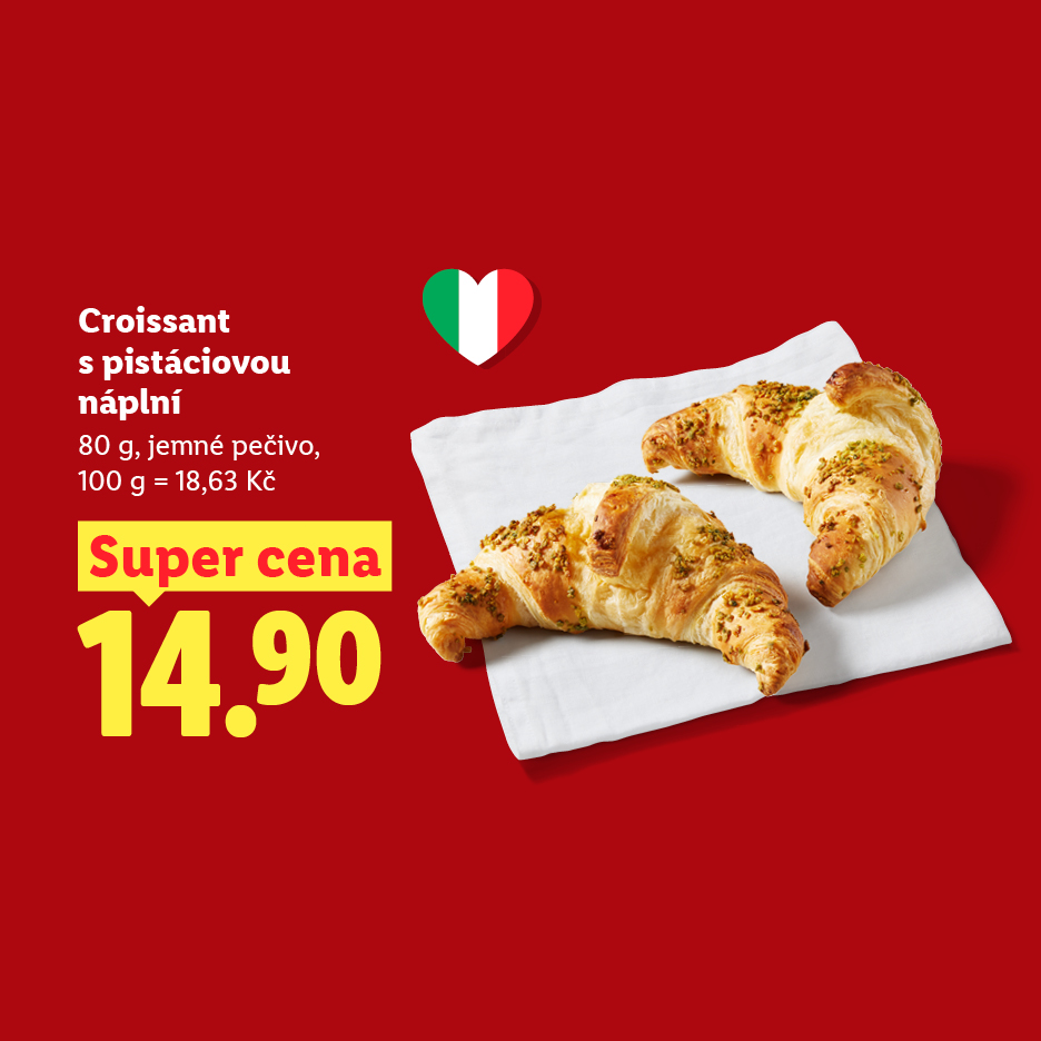Dva pistáciové croissanty na bílém ubrousku s cenou 14,90 Kč.